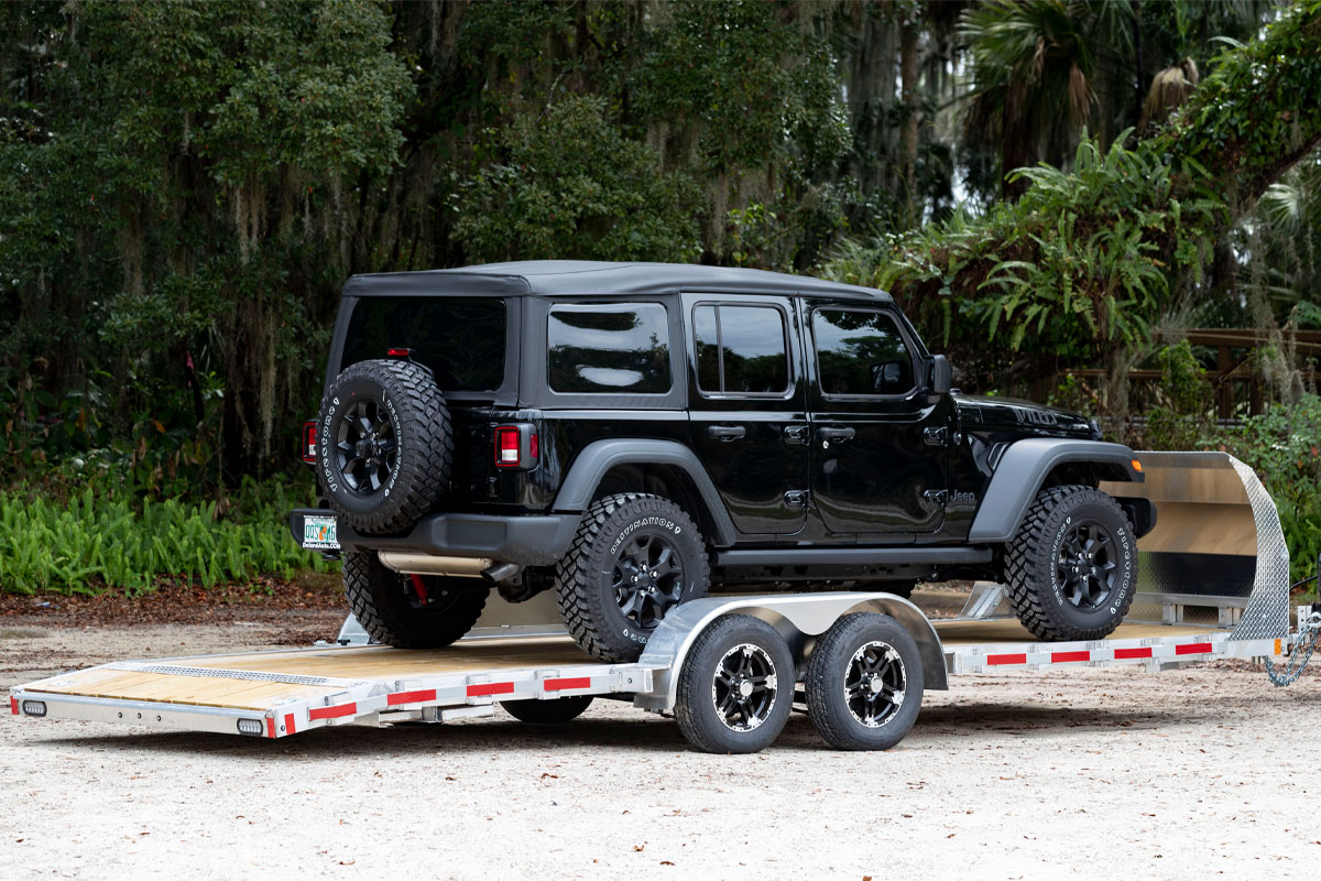 Black Jeep On Open Wood Deck Car Hauler