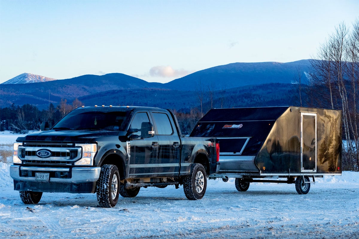 Black Parked Truck Pulling Black Snopro Hybrid Trailer